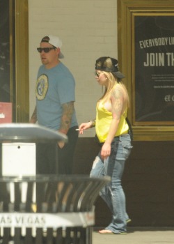 Then I turn down Fremont street and here this chick with half of her titty hanging out in front of the El Cortez.