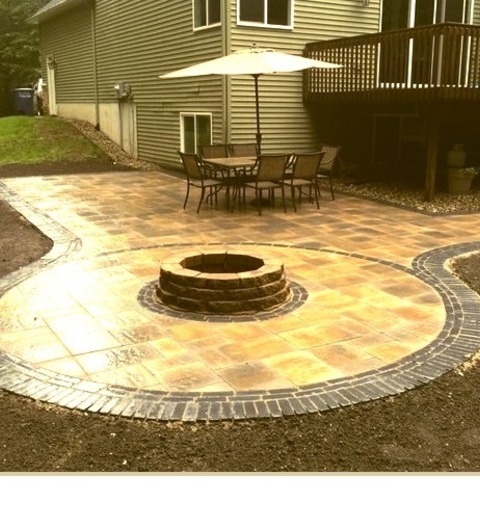 Grand Rapids PatioLarge Cottage Chic Backyard Concrete Paver Patio Photo With A Fire Pit And No Cover