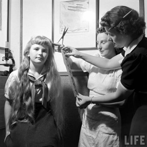 Girl donates her long blonde hair for the war effort(Thomas McAvoy. 1941)