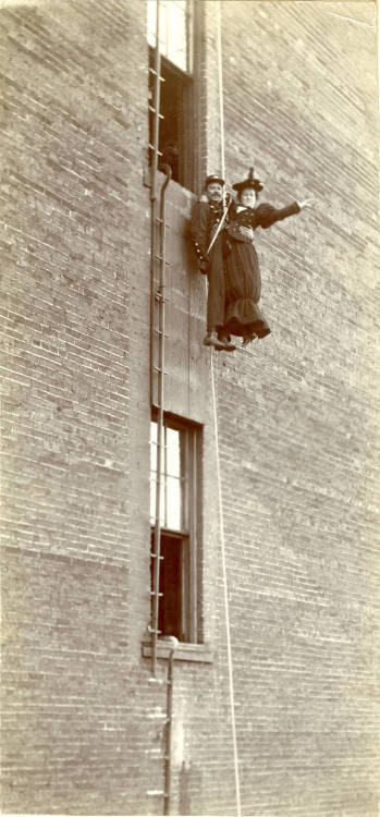 Kansas City fireman demonstrating the Pompier rescue method, late 19th century.