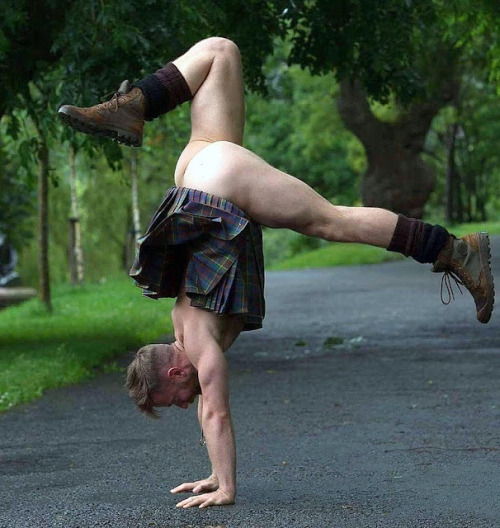 bearpicsbear:  Kilted yoga handstand- no need to call the Kilt Police here!The fact that his kilt is still attached to his hipbones and not sliding down shows that his kilt is very well fitted to his body.