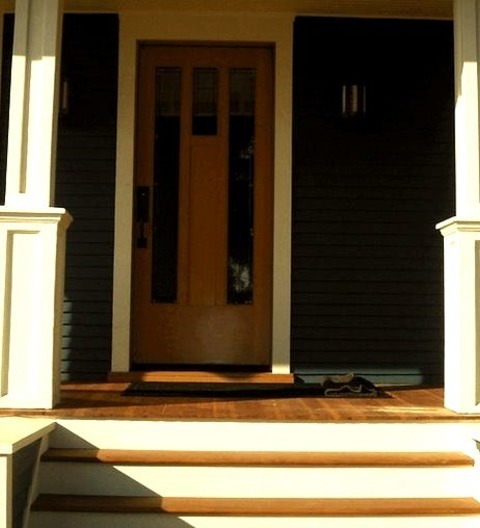 Front Door Mudroom Small Craftsman Entryway With A Light Wood Floor, Blue Walls, And A Medium Wood Front