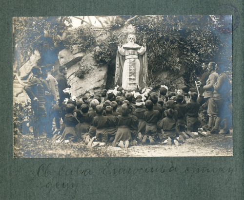 Serbian children praying in front of a statue of Saint Sava in an orphanage in Nice during WW1.
