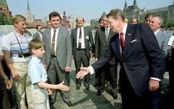 historicaltimes:  What is believed to be Vladimir Putin wearing a disguise, while watching President Reagan on his 1988 trip to Moscow. via reddit  It does look like him