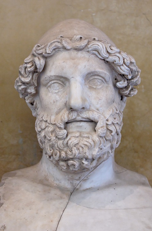 A bust of Hermes (sometimes identified as Hephaestus), wearing a pilos (conical cap).  Roman co
