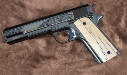 gunrunnerhell:  Turnbull 1911 A special edition 1911 made by Turnbull Manufacturing. Custom engraving with minimal gold inlay with giraffe bone grips. Serial number 1911001 makes this the first 1911 from Turnbull Mfg. Although very simple looking compared