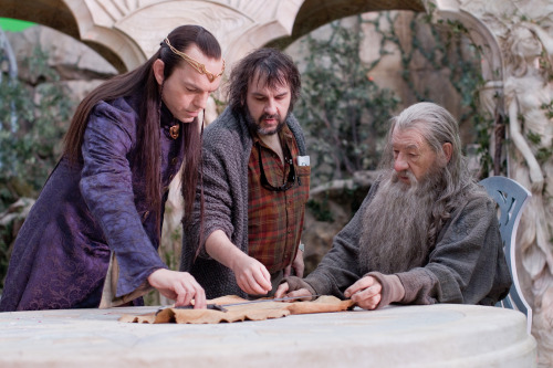 iamjaynaemarie:  Elrond and Gandalf inspect the merchandise on the set with some strange creature not in the script.That is the director. I could have sworn he was taller.He’s one of us, isn’t he? Company missing a dwarf?Oh come on, Gandalf. You know