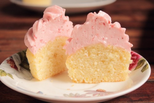 bakeddd:  lemon cupcakes with strawberry swiss meringue buttercream  click here for recipe 