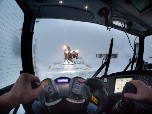 Behind the controls of a snowcat