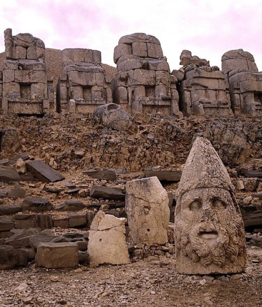 ancienthistoryart:Mount Nemrut, Taurus Mountains, Turkey. In 62 BC, King Antiochus I Theos of Commagene built on the mountain top a tomb-sanctuary flanked by huge statues 8–9 metre high of himself, two lions, two eagles and various Greek, Armenian and