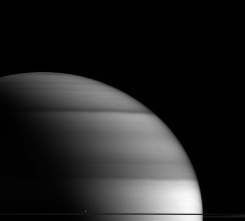 The Dew Drop Of Saturn : The Water-world Enceladus Appears Here To Sit Atop Saturns Rings Like A Drop
