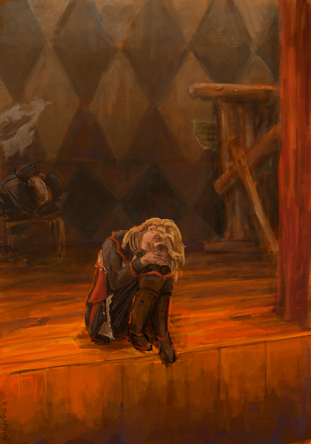 Anna Angel from Pathologic sits at the edge of a theatre stage, hugging her knees. The back wall is diamond patterned. The theatre backdrop is dirty and run down.