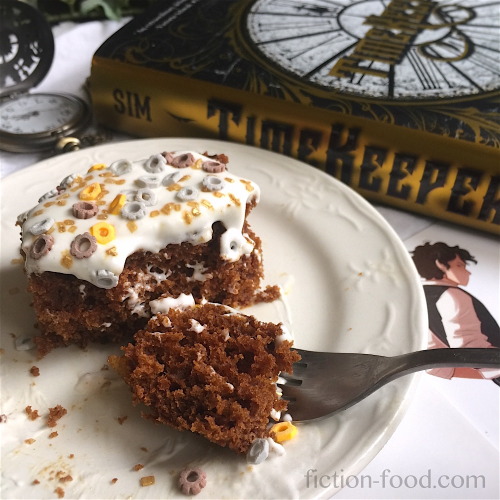 Gingerbread for TimeKeeper by Tara Sim     In the kitchen, a square of gingerbread wrapped in a clot