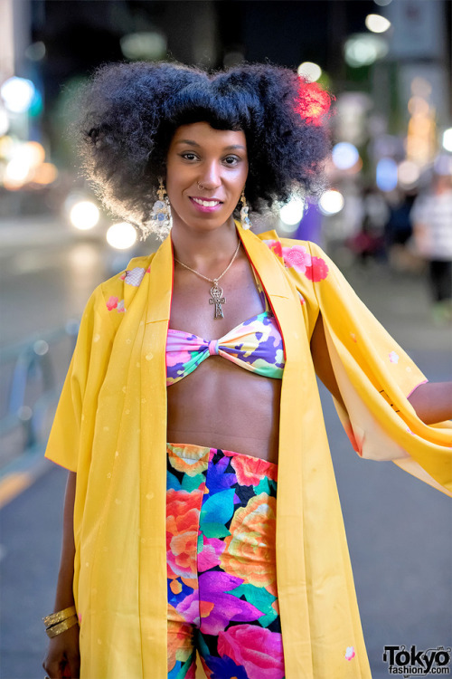 Dancer and stylist Leah McFly on the street in Harajuku wearing a colorful look with a vintage Hello