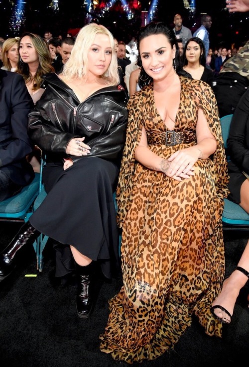 Christina Aguilera and Demi Lovato take their seats front row and centre at the 2018 BBMAS.