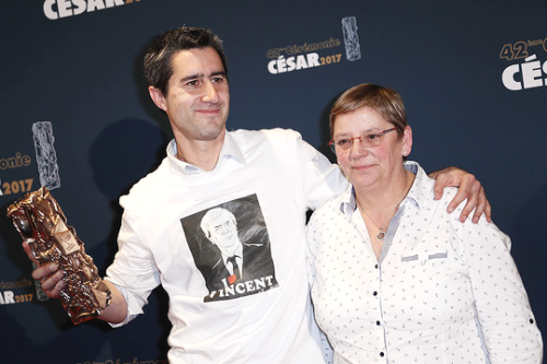 François Ruffin, wearing a t-shirt with the portrait of chairperson and CEO of French industr