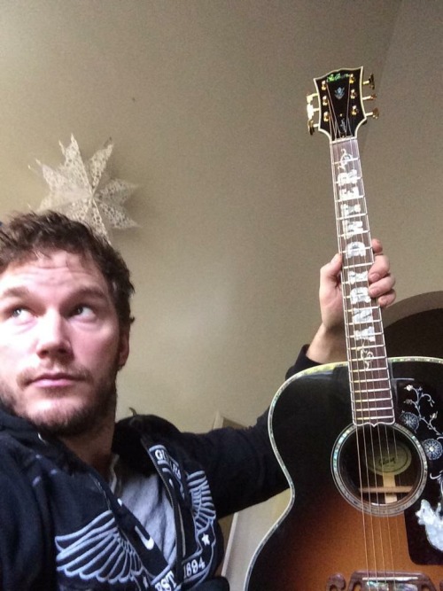 fuckestuppest:Chris Pratt and his new custom Andy Dwyer/Mouserat Gibson J-200tbh this was better whe