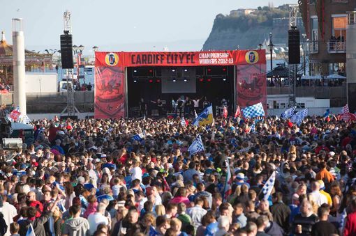 blue-madness-blue:  Cardiff City fans cheer their team on a day of sunshine celebrations