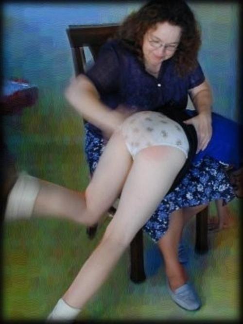 dundee47:Over mummy’s knee for a long hard hand spanking. Her kicking indicates that mummy is gettin