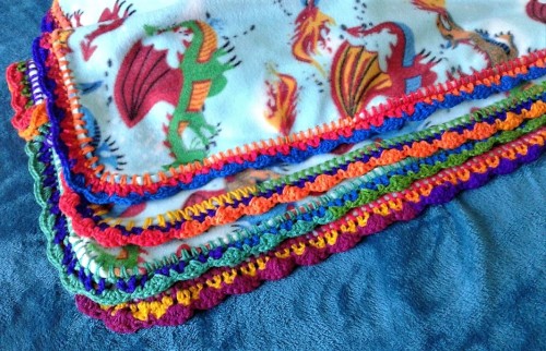 johnthestitcher:Another fleece blanket with a variegated rainbow yarn in primary colors. I bought a 