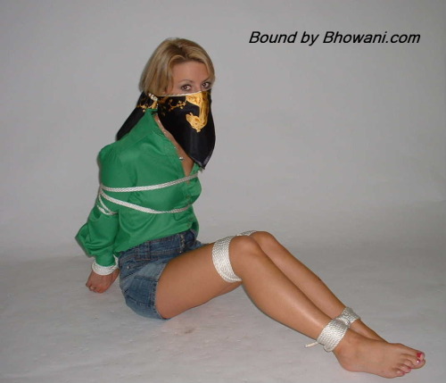 graybandanna:  Sabrina tied up in a green blouse with both a scarf cleave gag and a scarf over the nose gag