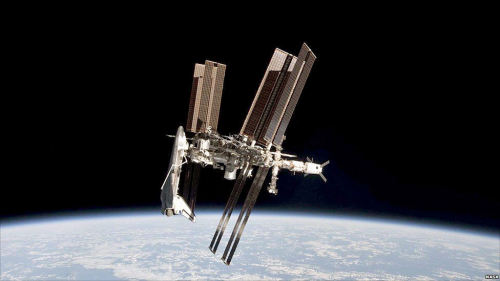 Space Travelfirst picture of Shuttle docking at the International Space Stationby Italian astronaut 