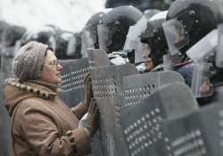 politics-war:  A woman addresses Ukrainian