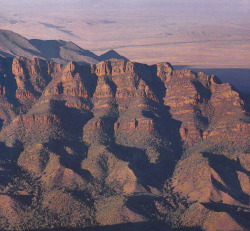 plant-scans:The striated cliffs and ridged foothills of Wilpena Pound in the Flinders Ranges National Park, Discover Australia’s National Parks &amp; Naturelands, Michael and Irene Morcombe, 1983