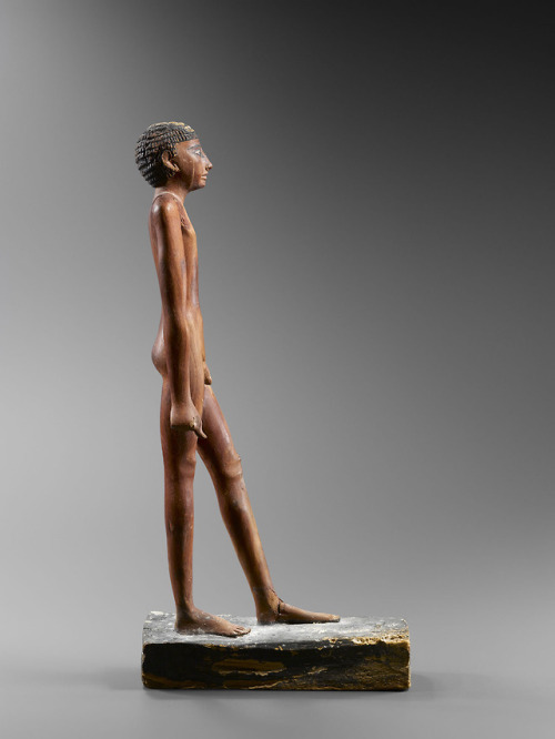 Statuette of a nude man (wood and pigment). Late Old Kingdom, 6th-8th Dynasty, ca. 2345-2160 BC. Ex 