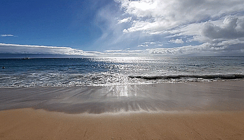 reasonandfaithinharmony:Waves breaking on the coast of Maui. Lanai and Molokai on the horizon.