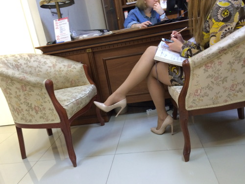 Lady in office. Ilove her crossed legs and high arched feet!