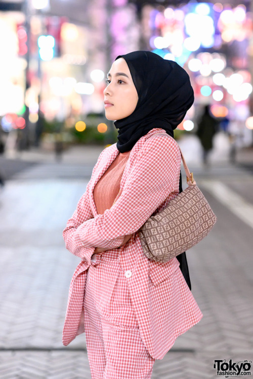 tokyo-fashion:  Amelia Elle, a hijabi fashion blogger from Indonesia, on the street in Shibuya, Tokyo wearing a pink check Zara suit, Fendi logo bag, and pink Chanel sneakers. Full Look