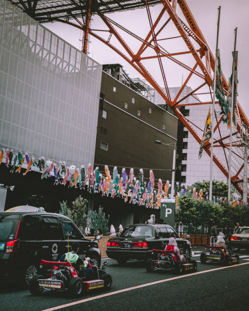 Koinobori with Tokyotower in the background Koinobori(colorful fish flags) is flapping outside in ce