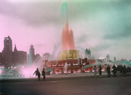 Summer strollers watch a colorful water fountain display at night, Chicago, May 1931.Photograph by C