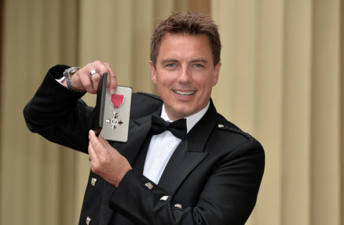 nixxie-fic:More New Pictures of John Barrowman getting his MBE from Princess Anne at Buckingham Pala