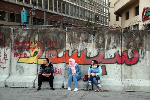 “These walls will fall” Protest graffiti seen on the ‘walls of shame’ surrou