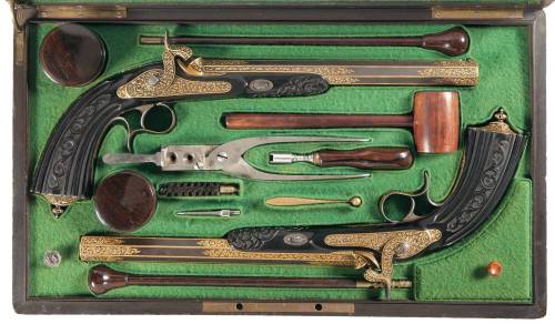 Magnificent cased, gold inlaid, and engraved pair of percussion dueling pistols by Prelat of Paris, 