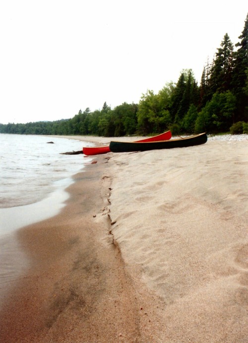 An old scanned photo of our canoes beached on Lake Superior.