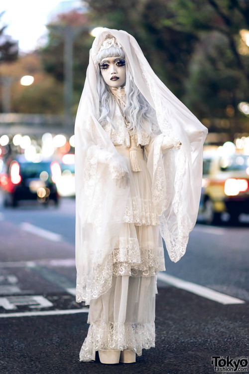 Japanese shironuri artist Minori on the street in Harajuku with hand painted makeup as well as handm