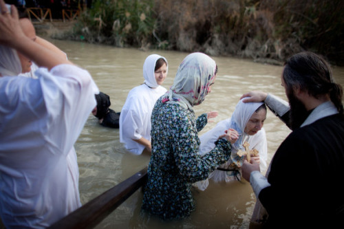 christianityoutsidethewest:Orthodox Christians Celebrate Epiphany At The River Jordan, Eritrean