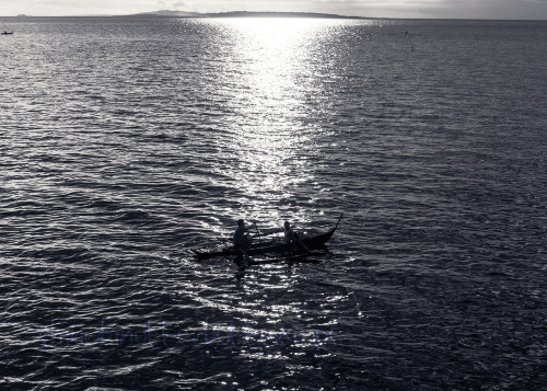 Out in the Open Waves charge at the rocks Nets are cast and hooks are launched Sun-kissed horizon