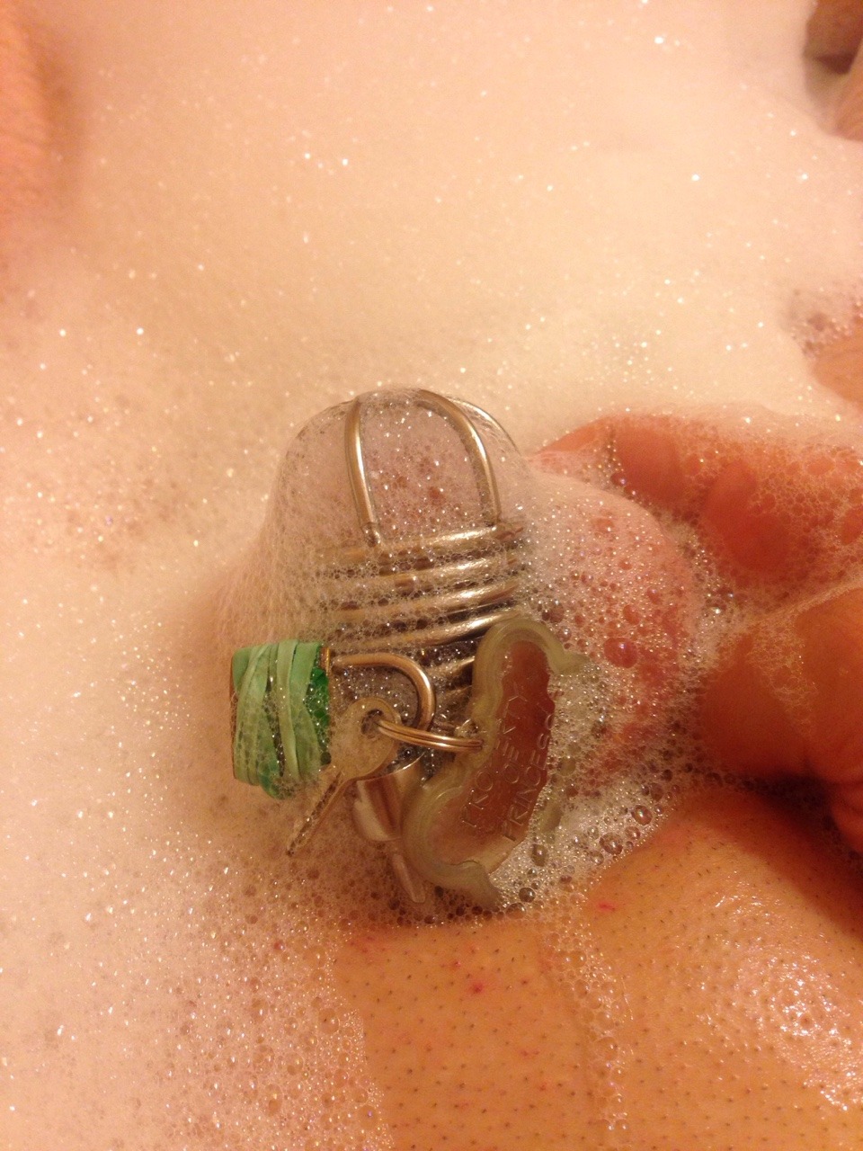 show-us-your-locked-cock:  Locked with the key in sight while taking a bubble bath.