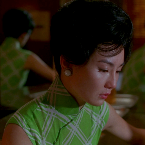 hoanbee:  Maggie Cheung wears a different cheongsam (qipao) dress in each scene of Wong Kar-Wai’s In the Mood For Love. There were 46 in all, though not all made it to the final cut. 