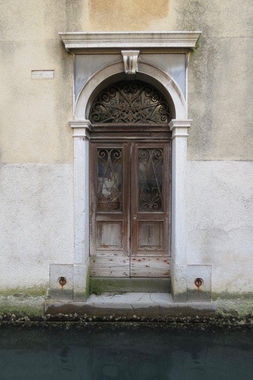 Venice, Italy - a front door leading to the canal