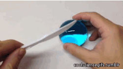 coolsciencegifs:  More polymer ball craziness. The clear, colourless small polymer balls are placed in coloured water where they expand over time, absorbing water and colour. The polymer completely binds to the water… so even when the ball is cut open,