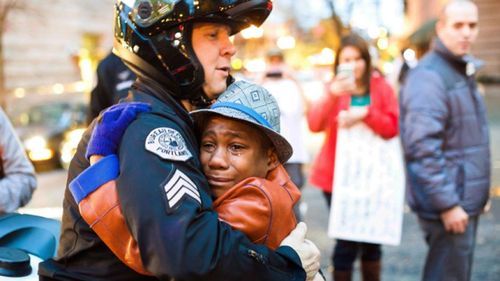 "Ferguson Hug" Photo Staged, Cropped