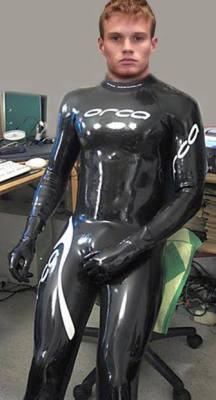nylonguy12:  love shiny and wet look and a big cock too!!!!   Love the suit, wish I had him  :)