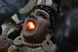 Sixpenceee:   A Hindu Man Dressed As Lord Shiva Holds A Lit  Candle In His Mouth