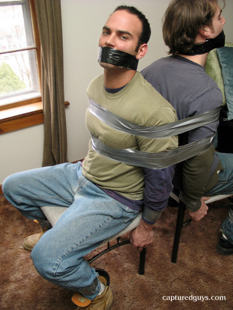 There is just nothing quite like seeing a hunky guy in jeans tied and gagged to a chair with ta