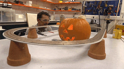 did-you-kno:  ri-science:  LEVITATING PUMPKINS! “And the cursed pumpkin rose up from the earth, carried to the sky by the spirits of All Hallows’ Eve.” Or in other words, Andy put a superconductor in a pumpkin and levitated it on a magnetic track.